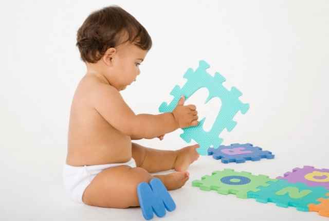 baby playing with puzzles