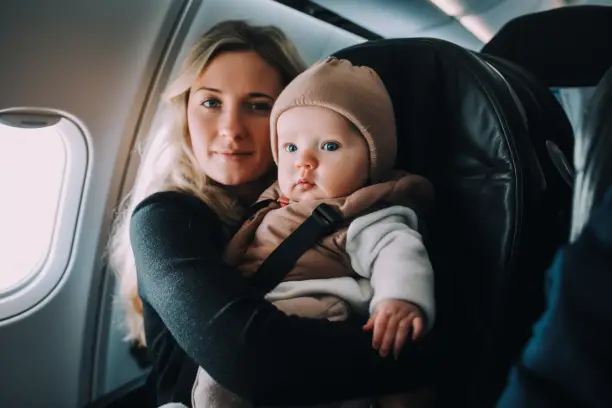 wearing a baby carrier on plane